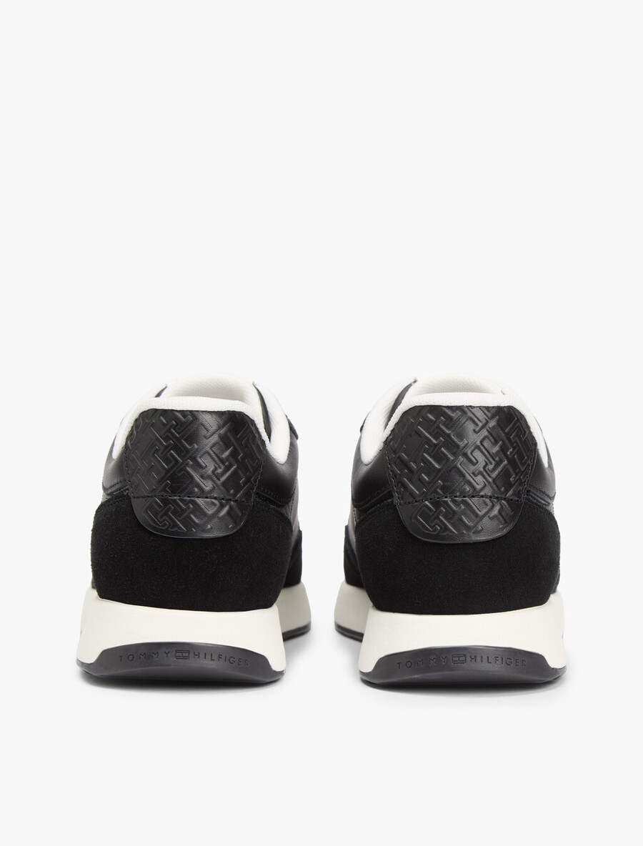 sneaker aus geprägtem th-monogramm-leder